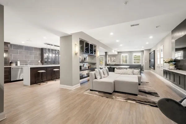 a large room with kitchen view