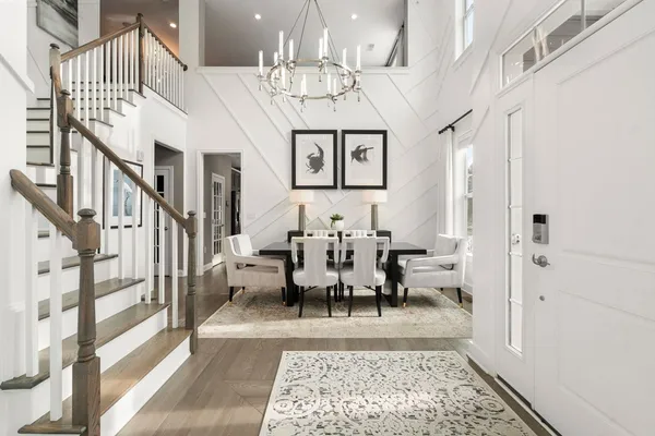 a view of an entryway and hall with dining area