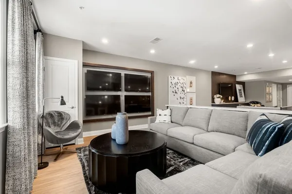 a living room with furniture and a large window