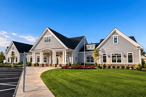 a front view of a house with a yard