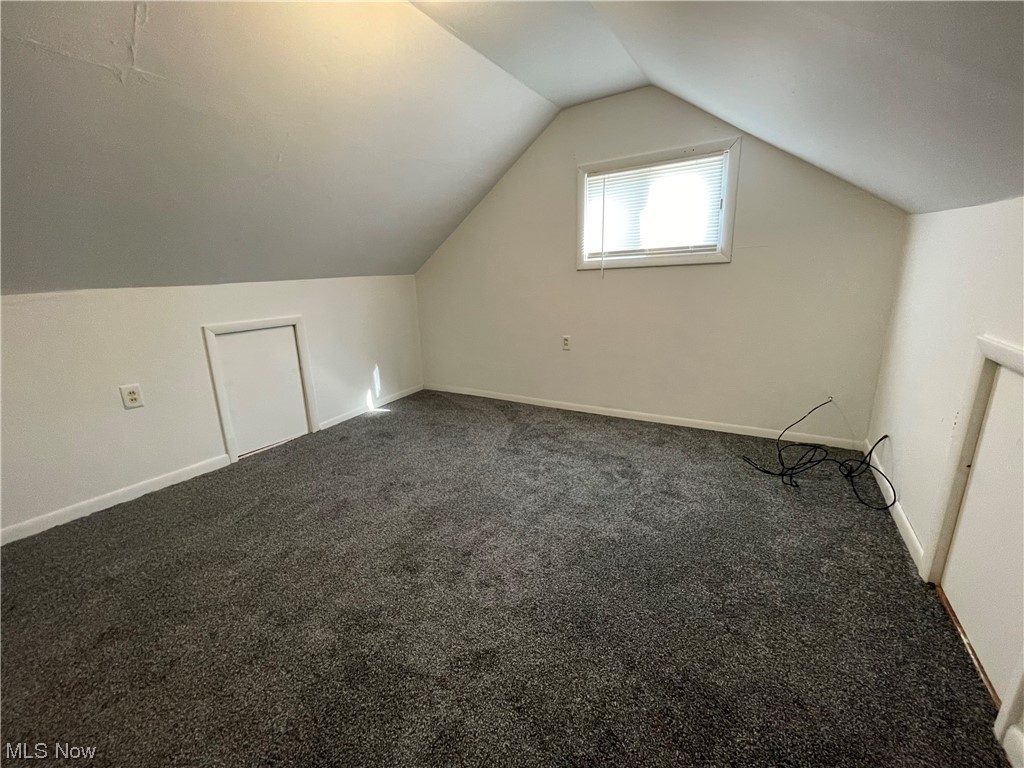 415 North Home Road Mansfield, OH 44906 - Photo 23 of 26 Bedroom featuring lofted ceiling and dark colored carpet