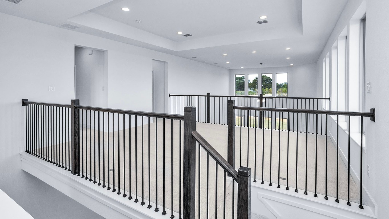 22306 Japanese Maple Lane Hockley, TX 77447 - Photo 13 of 18 a view of a hallway with wooden floor