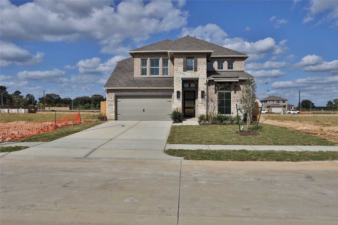 22306 Japanese Maple Lane Hockley, TX 77447 - Photo 16 of 18 a front view of a house with a yard