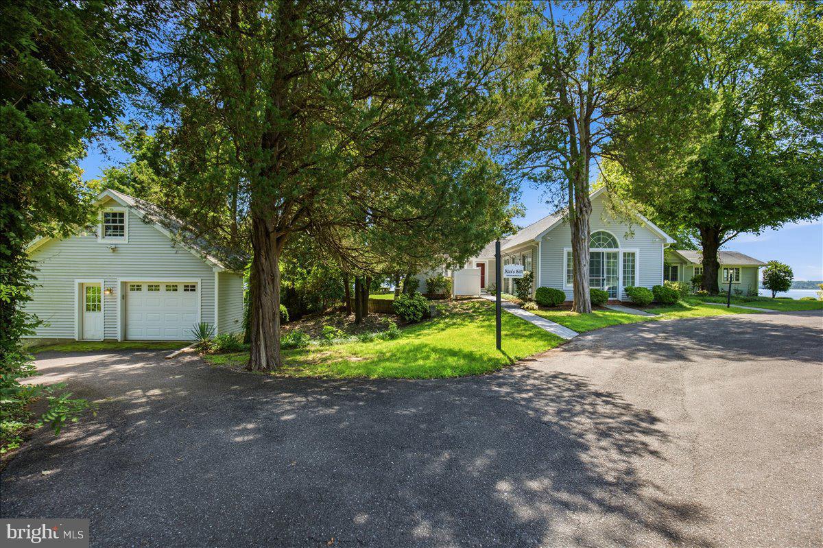 6110 Sheridan Point Road Prince Frederick, MD 20678 - Photo 17 of 77 Charming homes nestled in lush greenery.