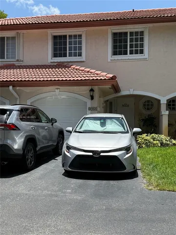 a view of car parked in front of house