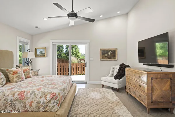 a bathroom with a granite countertop sink a mirror a shower and a bathtub