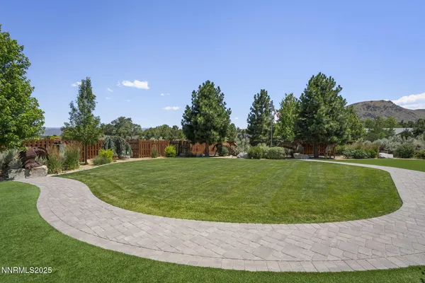 a wooden bench sitting in the grass