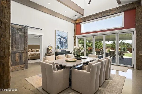 a view of a dining room with furniture window and a kitchen