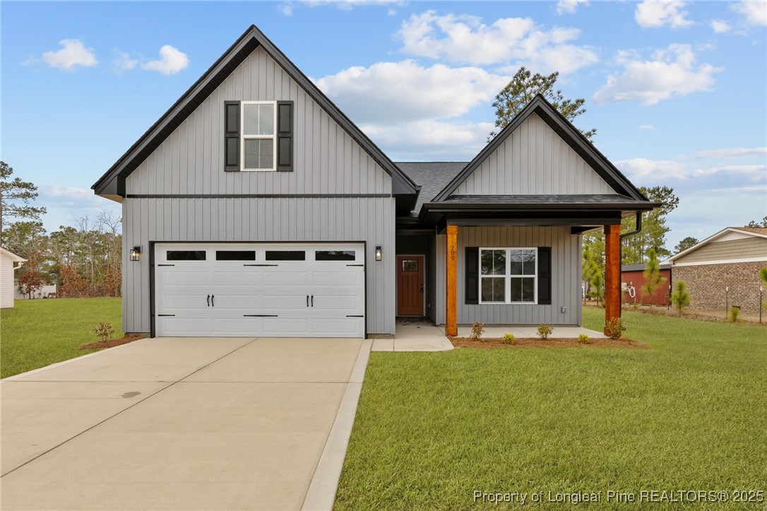 209 Mumford Road Raeford, NC 28376 - Photo 1 of 43 a front view of a house with yard