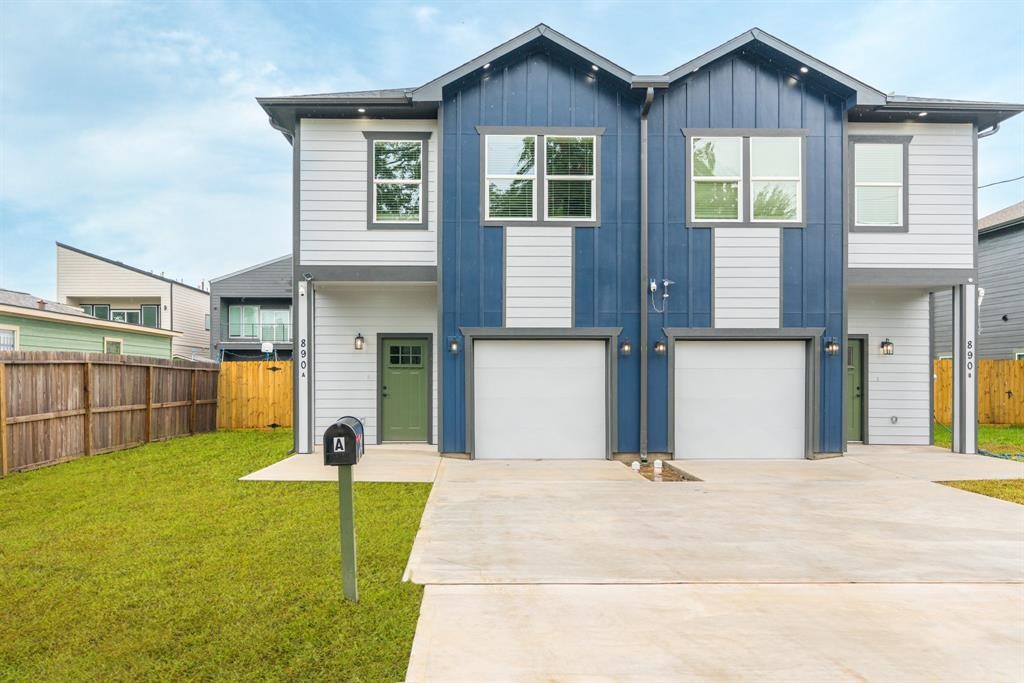 890 Lucky Street, Unit A Houston, TX 77088 - Photo 1 of 48 a front view of a house with a garden and yard