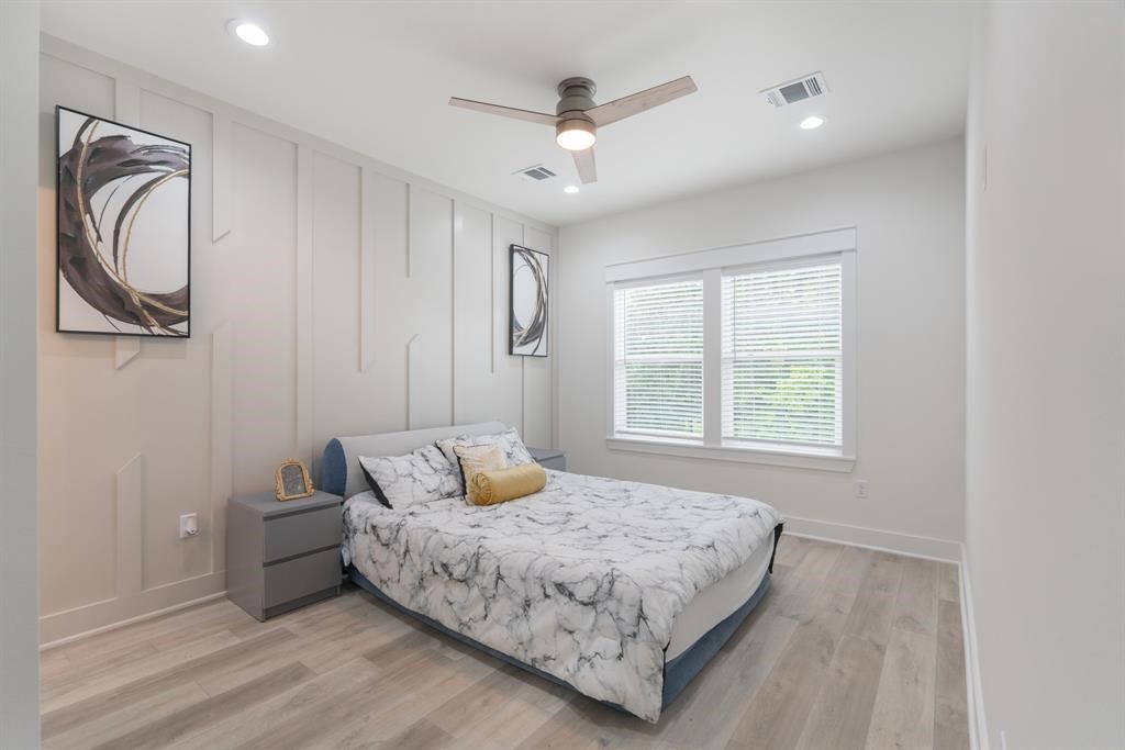 890 Lucky Street, Unit A Houston, TX 77088 - Photo 29 of 48 a bedroom with a bed and window