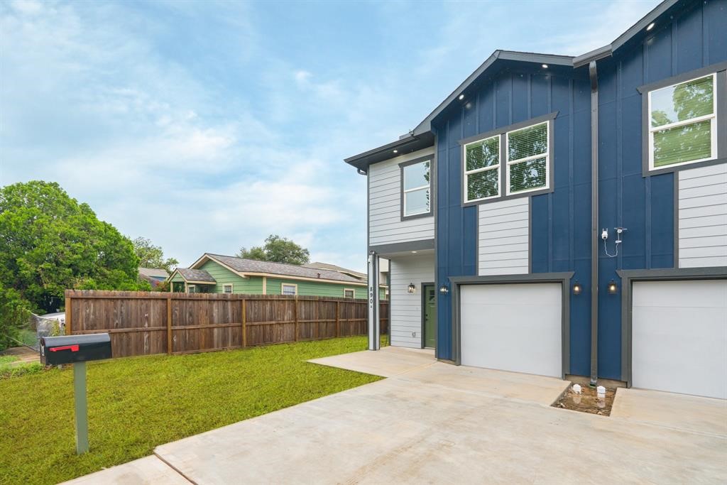 890 Lucky Street, Unit A Houston, TX 77088 - Photo 4 of 48 a view of a backyard that has plants and large tree