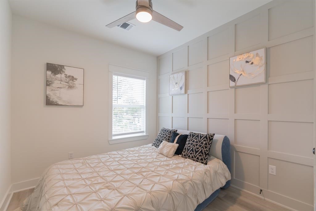 890 Lucky Street, Unit A Houston, TX 77088 - Photo 41 of 48 a bedroom with a bed and a window