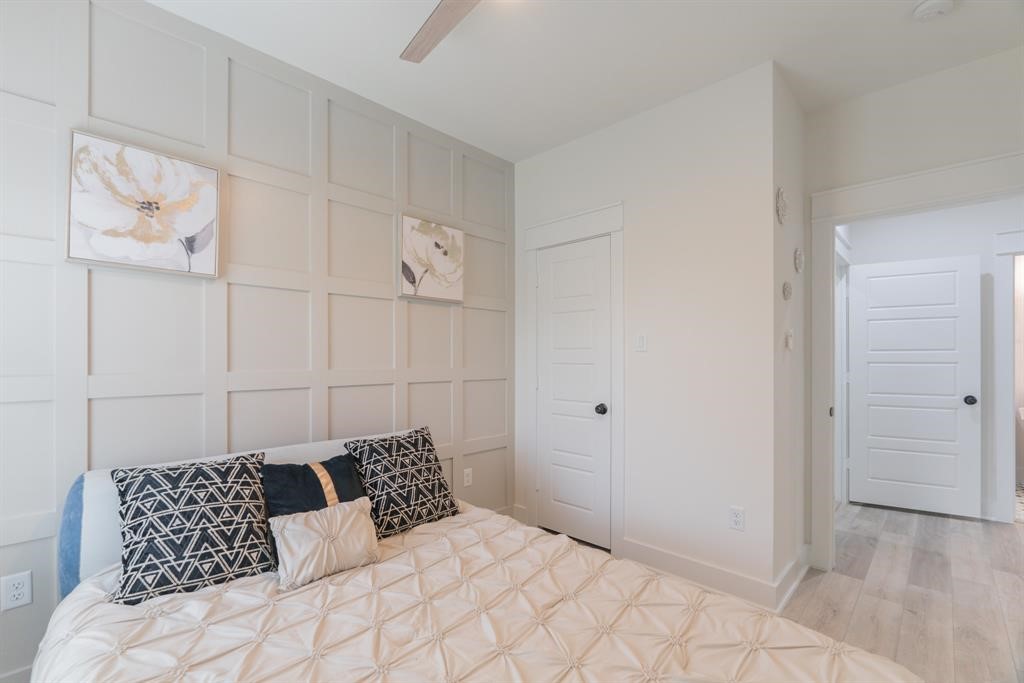 890 Lucky Street, Unit A Houston, TX 77088 - Photo 42 of 48 a bedroom with a bed and a cabinets