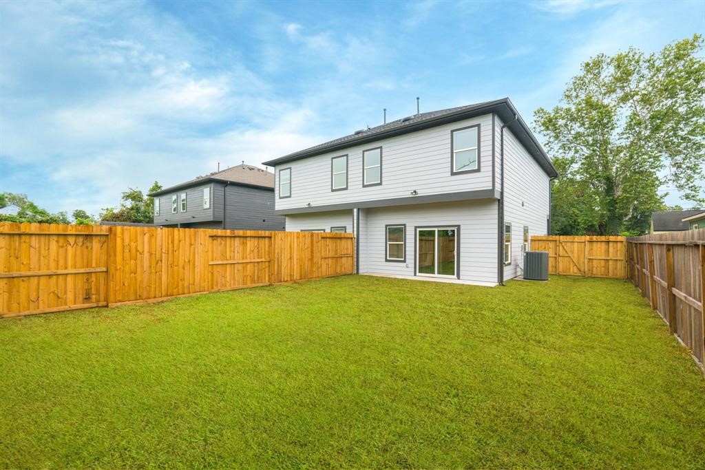890 Lucky Street, Unit A Houston, TX 77088 - Photo 47 of 48 a view of an house with backyard and fence