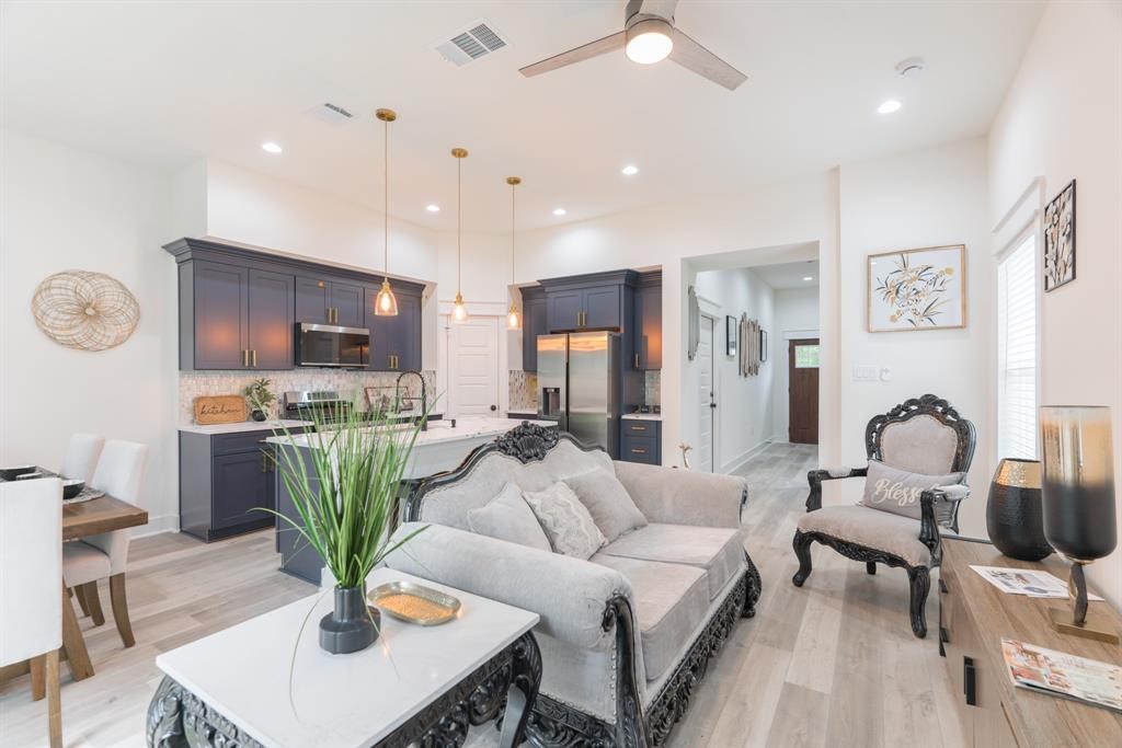 890 Lucky Street, Unit A Houston, TX 77088 - Photo 8 of 48 a living room with furniture potted plant and kitchen view