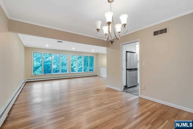 32 Rock Road Englewood Cliffs, NJ 07632 - Photo 11 of 30 a view of an empty room with wooden floor and a window