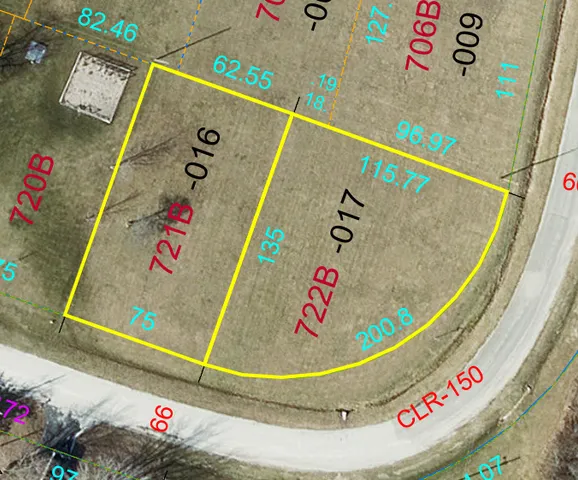 a view of a swimming pool with a yard