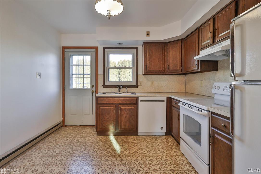 221 North Ruch Street Coplay, PA 18037 - Photo 8 of 25 Kitchen goes out to back deck.