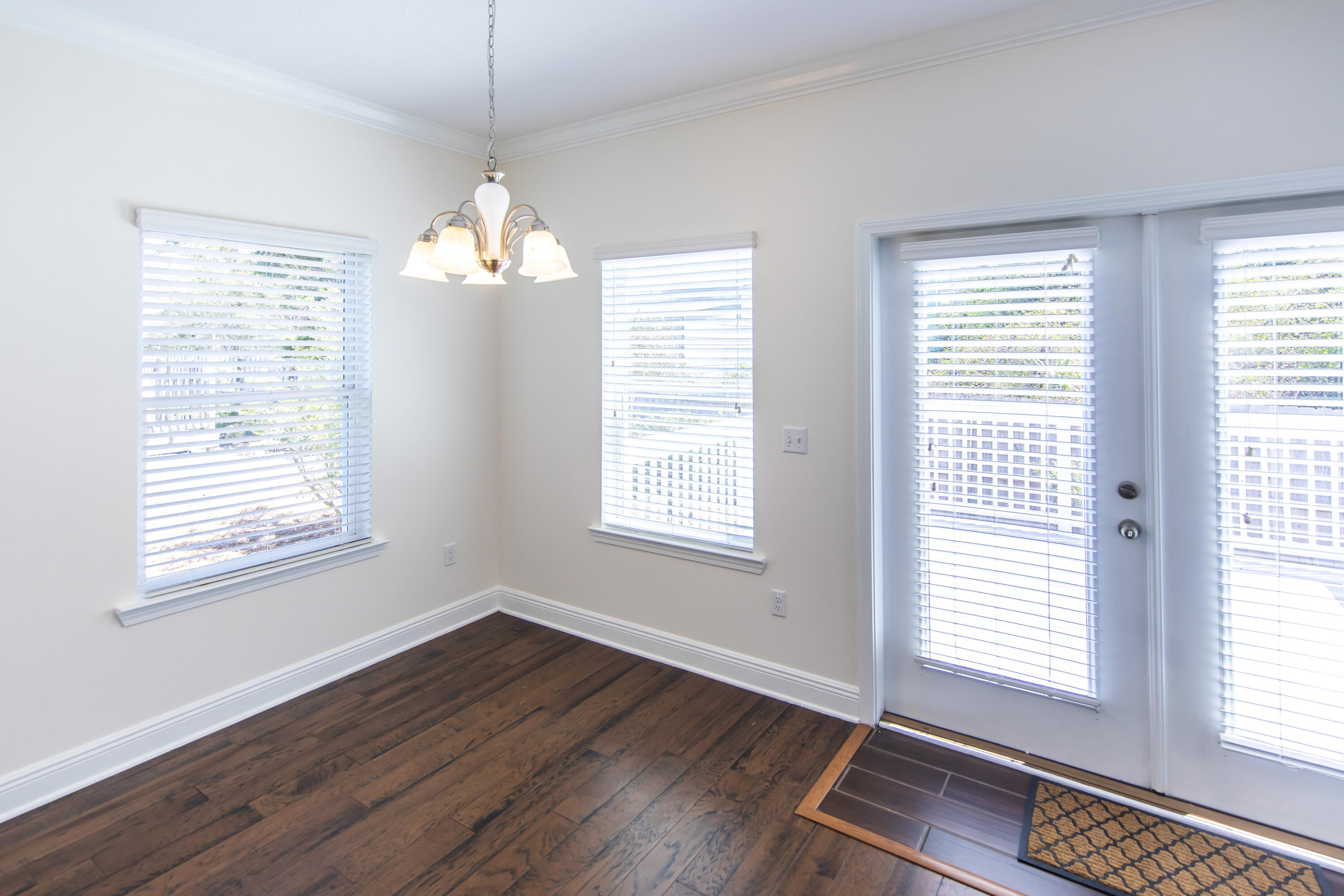 144 Grayling Way Inlet Beach, FL 32461 - Photo 12 of 19 a view of an empty room with wooden floor and a window
