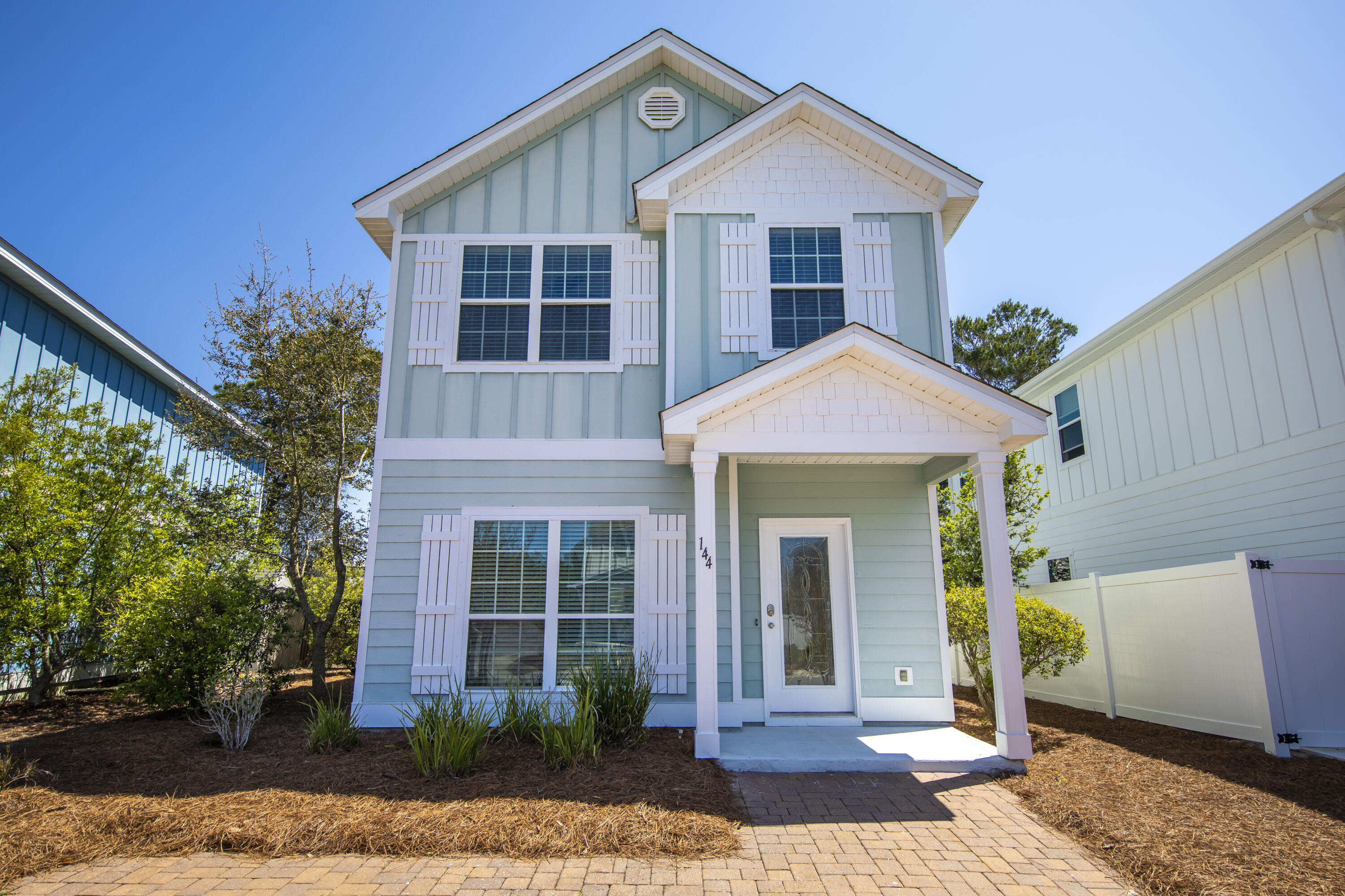 144 Grayling Way Inlet Beach, FL 32461 - Photo 4 of 19 a front view of a house with garden