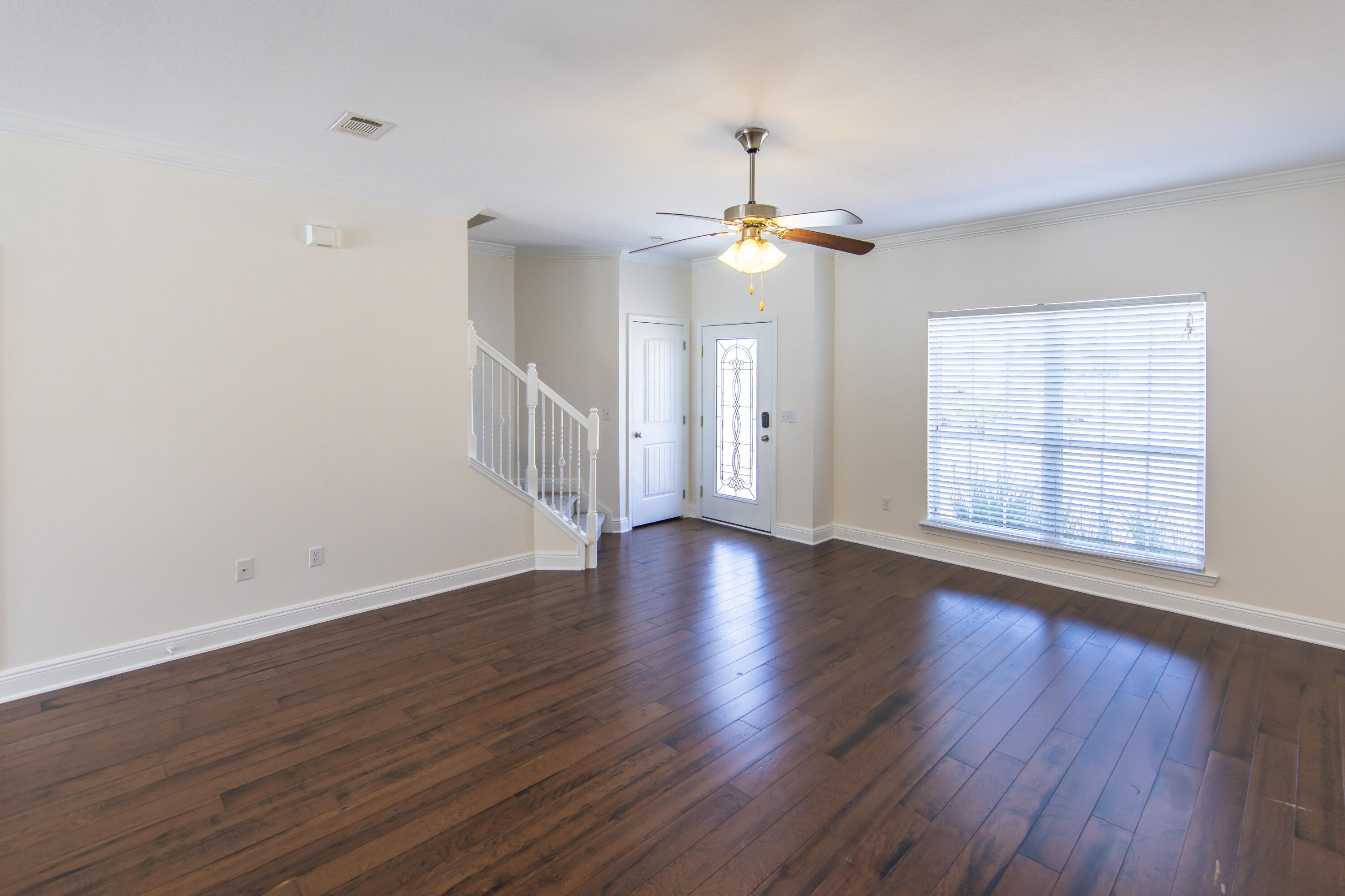 144 Grayling Way Inlet Beach, FL 32461 - Photo 6 of 19 a view of an empty room with wooden floor and a window