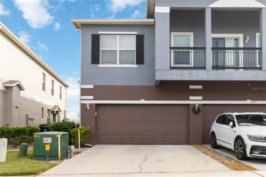 a view of a car park in front of a building