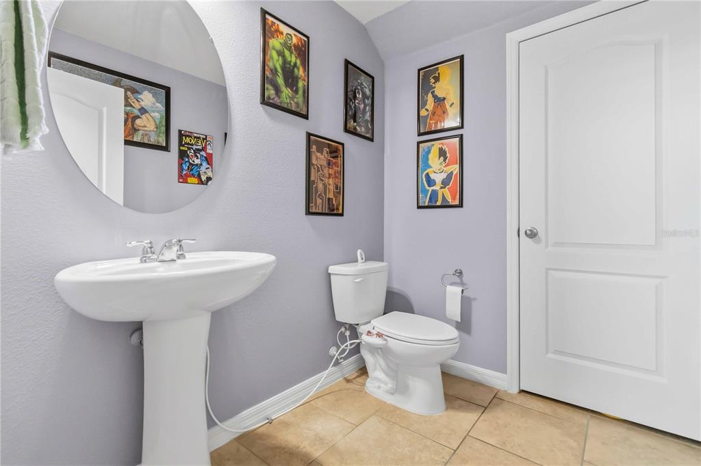 6560 South Goldenrod Road, Unit 79C Orlando, FL 32822 - Photo 16 of 36 a bathroom with a toilet sink and mirror