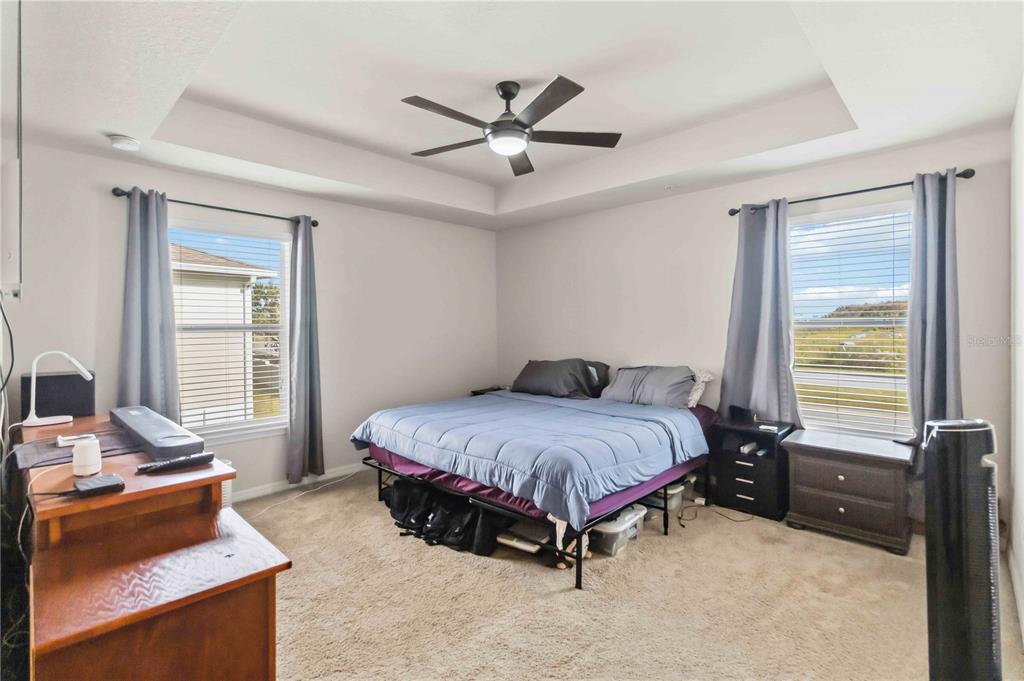6560 South Goldenrod Road, Unit 79C Orlando, FL 32822 - Photo 18 of 36 a spacious bedroom with a bed and window