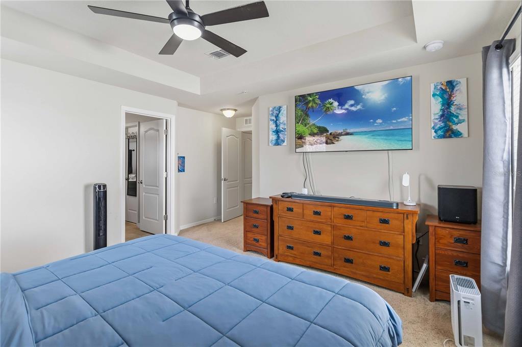 6560 South Goldenrod Road, Unit 79C Orlando, FL 32822 - Photo 20 of 36 a bedroom with a bed and a flat screen tv