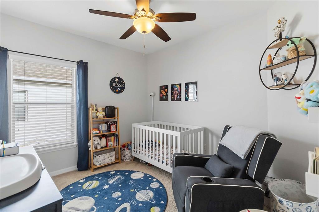 6560 South Goldenrod Road, Unit 79C Orlando, FL 32822 - Photo 23 of 36 a bedroom with furniture and a window