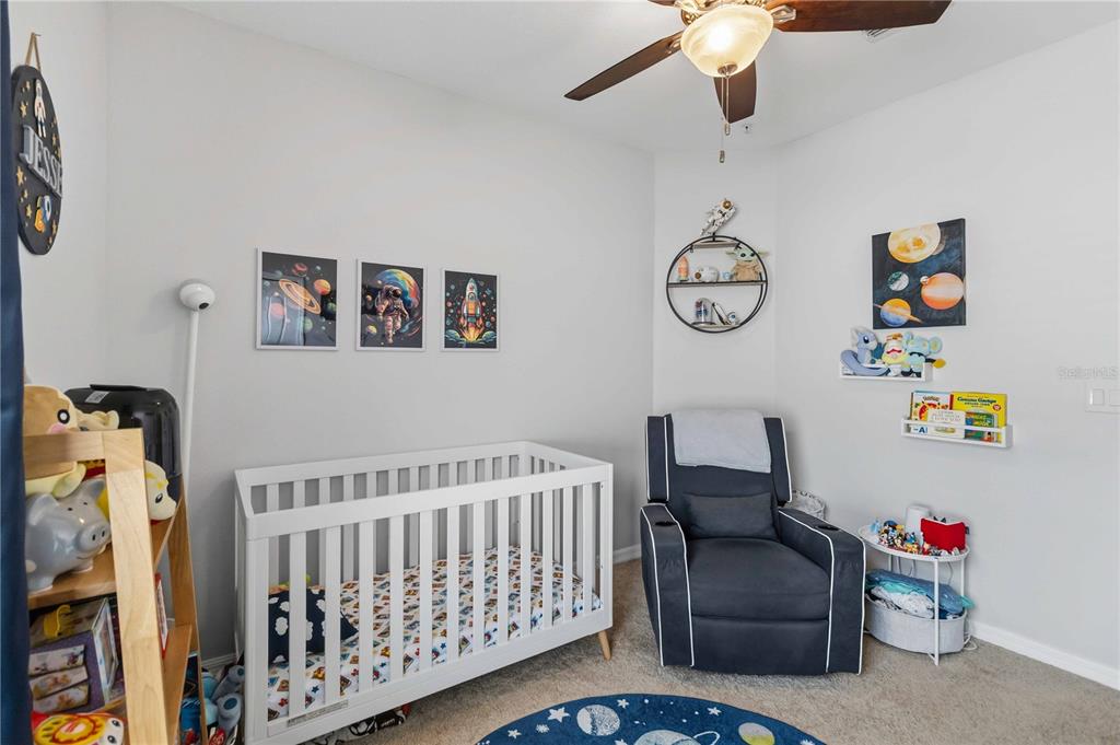 6560 South Goldenrod Road, Unit 79C Orlando, FL 32822 - Photo 24 of 36 a bedroom with furniture and a bed