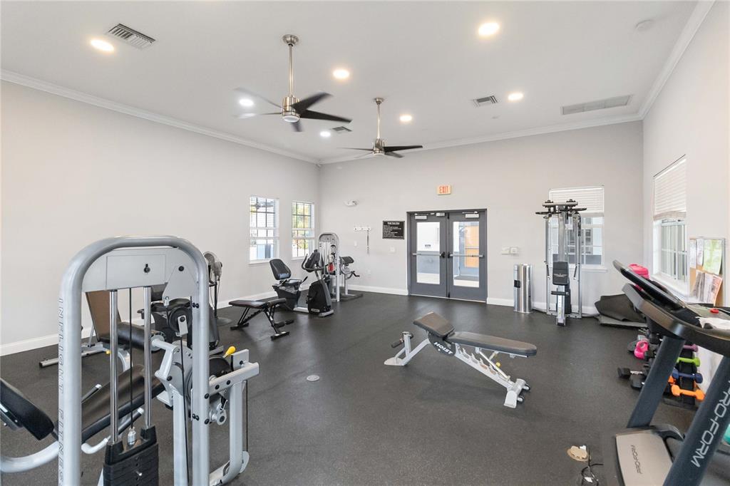 6560 South Goldenrod Road, Unit 79C Orlando, FL 32822 - Photo 31 of 36 a view of a room with gym equipment