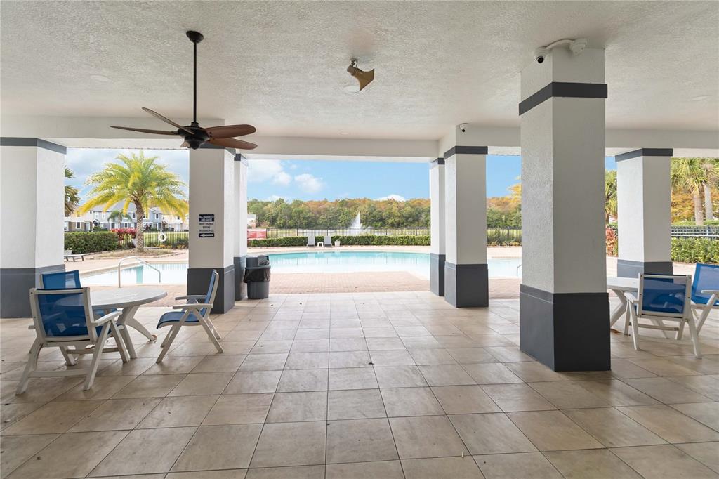 6560 South Goldenrod Road, Unit 79C Orlando, FL 32822 - Photo 33 of 36 a lobby with furniture and floor to ceiling windows