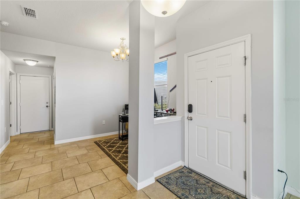 6560 South Goldenrod Road, Unit 79C Orlando, FL 32822 - Photo 5 of 36 a view of entryway with livingroom