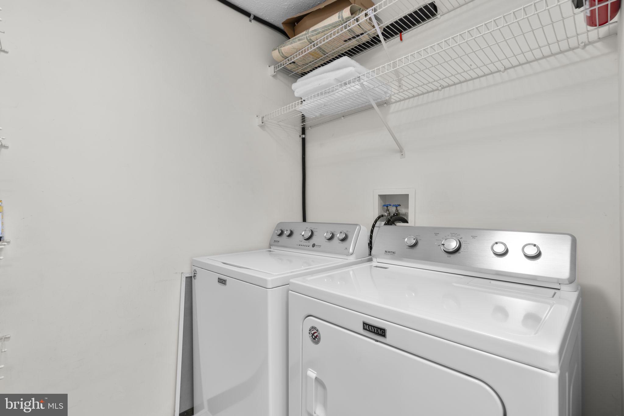 2444 Blue Spring Court, Unit 203 Odenton, MD 21113 - Photo 17 of 36 a utility room with dryer and washer