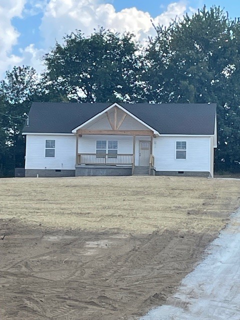 2741 Mc Connell Road Cornersville, TN 37047 - Photo 11 of 12 a front view of a house with a garden