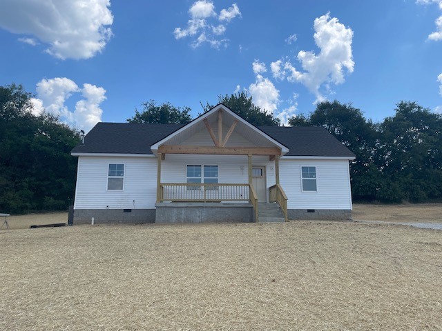 2741 Mc Connell Road Cornersville, TN 37047 - Photo 12 of 12 a front view of a house with a yard and garage