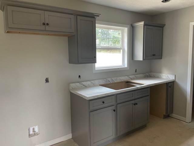 2741 Mc Connell Road Cornersville, TN 37047 - Photo 6 of 12 a kitchen with a sink cabinets and a window