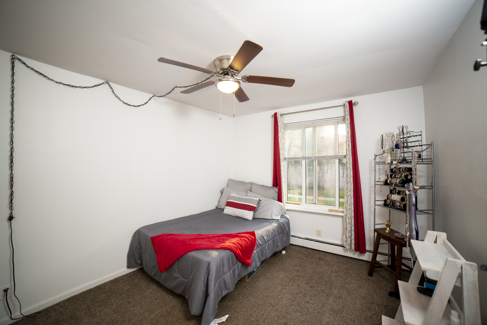 1900 Light Road, Unit 103 Oswego, IL 60543 - Photo 8 of 14 a bedroom with a bed and a window