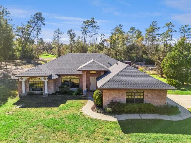front view of a house with a yard