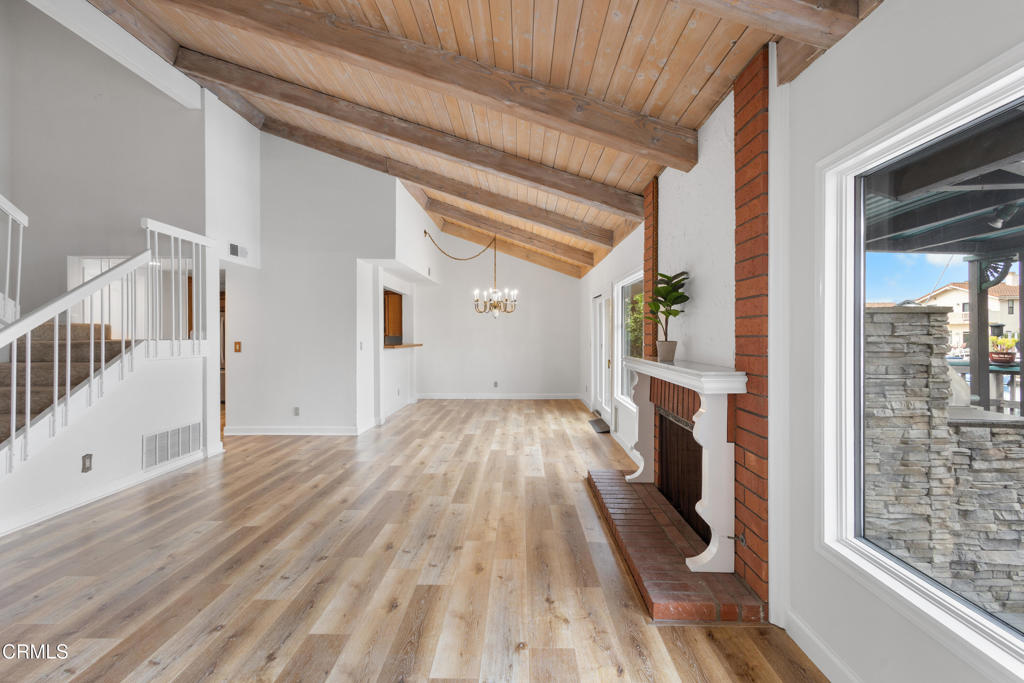 2524 Monaco Drive Oxnard, CA 93035 - Photo 14 of 50 a view of empty room with wooden floor and fireplace
