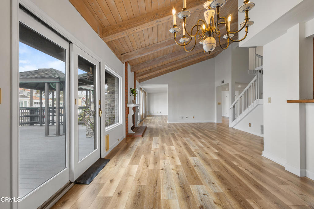 2524 Monaco Drive Oxnard, CA 93035 - Photo 18 of 50 a view of a hallway with wooden floor and staircase