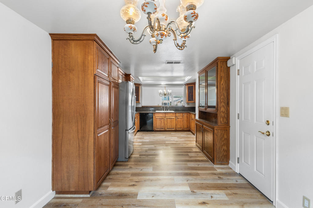 2524 Monaco Drive Oxnard, CA 93035 - Photo 23 of 50 a view of a hallway with wooden floor