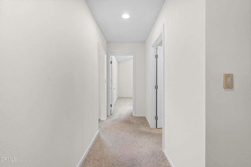 2524 Monaco Drive Oxnard, CA 93035 - Photo 24 of 50 a view of a hallway with wooden floor