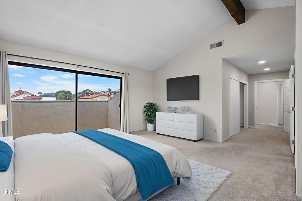 2524 Monaco Drive Oxnard, CA 93035 - Photo 32 of 50 a bedroom with a large bed and a flat tv screen on dresser