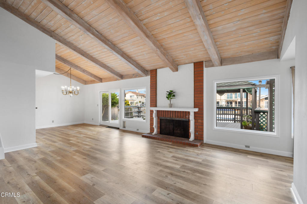 2524 Monaco Drive Oxnard, CA 93035 - Photo 4 of 50 a view of a livingroom with wooden floor a fireplace and window