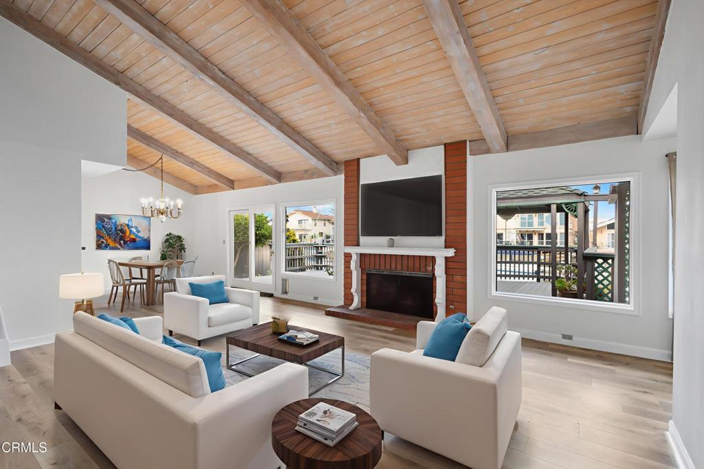 2524 Monaco Drive Oxnard, CA 93035 - Photo 5 of 50 a living room with furniture a fireplace and a flat screen tv