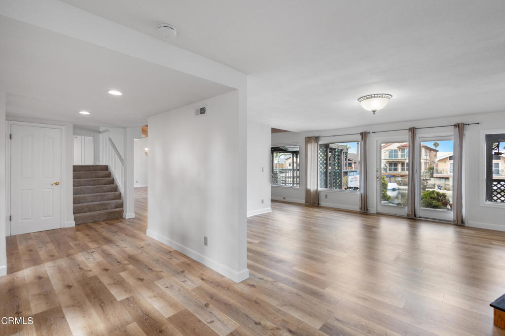 2524 Monaco Drive Oxnard, CA 93035 - Photo 10 of 50 a view of an empty room with wooden floor and a window