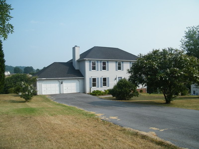 206 Aftons Meadow Road Vinton, VA 24179 - Photo 1 of 6 a front view of a house with a yard and garage